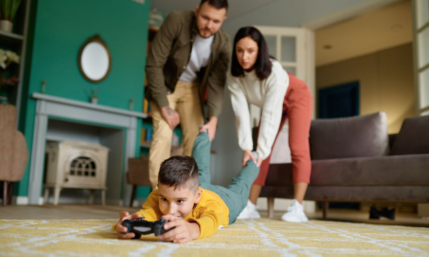 Parents dragging child away from video games