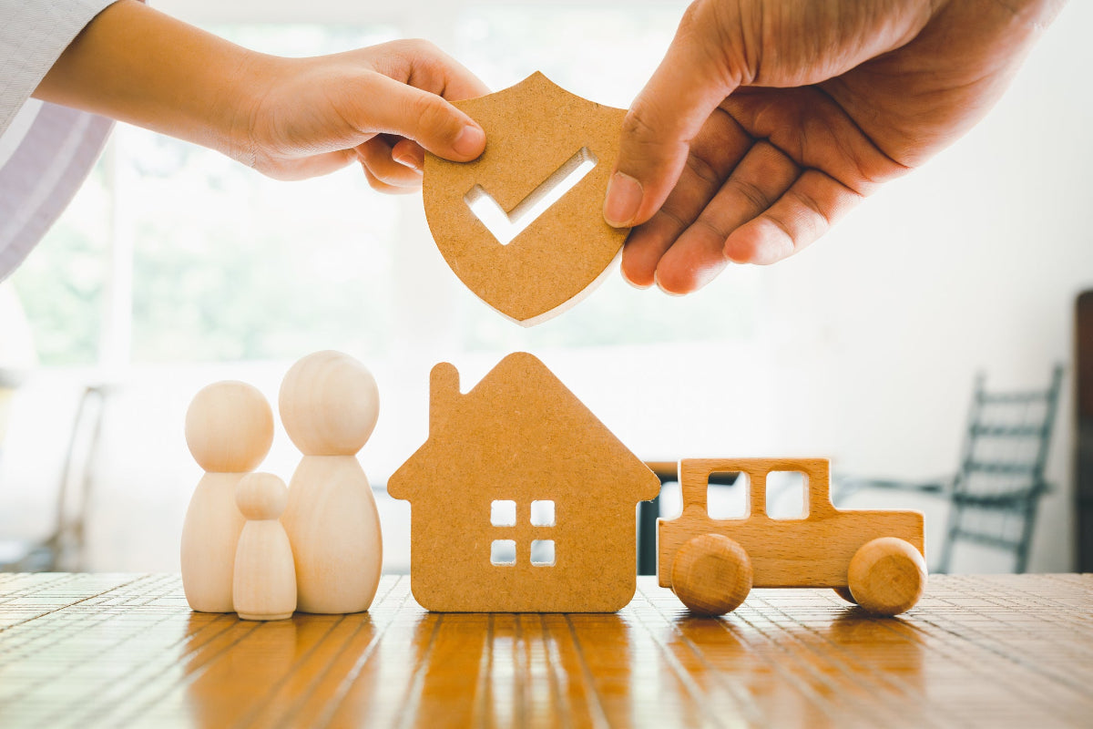Family image with parent and child holding security cutout together.
